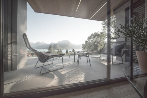 Terrasse extérieure avec vue sur le lac : Photo d'une terrasse élégante avec mobilier de jardin et vue sur le lac d'Annecy.